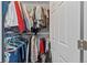 Walk-in closet with metal rod for organizing clothing and storage space at 11062 Gaylord St, Northglenn, CO 80233