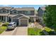 Inviting exterior view showcasing the home's curb appeal, with a driveway and well-manicured lawn at 11062 Gaylord St, Northglenn, CO 80233
