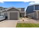 Charming two-story home with a well-maintained lawn, a driveway, and a one car garage at 11062 Gaylord St, Northglenn, CO 80233