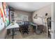 Office/craft room setup with window and multiple tables for projects at 11062 Gaylord St, Northglenn, CO 80233