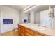 Spacious bathroom with tile floors, double sink vanity and well-lit mirror at 2560 Concord Cir, Lafayette, CO 80026