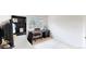 Bright bedroom features a piano, large window, and built in black bookshelves at 2560 Concord Cir, Lafayette, CO 80026