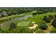 Aerial view of the golf course featuring its water features and lush greenery at 2560 Concord Cir, Lafayette, CO 80026
