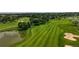 Aerial view of the golf course featuring its water features and lush greenery at 2560 Concord Cir, Lafayette, CO 80026