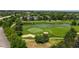 Aerial view of the golf course featuring its water features and lush greenery at 2560 Concord Cir, Lafayette, CO 80026