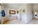 Bright hallway featuring a closet, dresser, mirror and natural light at 2560 Concord Cir, Lafayette, CO 80026