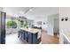 Bright kitchen with island and view to the dining room and a balcony at 2560 Concord Cir, Lafayette, CO 80026