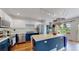 Bright eat-in kitchen features an island, stainless steel appliances, and white cabinets at 2560 Concord Cir, Lafayette, CO 80026