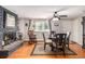 Dining area with fireplace and hardwood floors near kitchen at 2612 Meadowbrook Dr, Denver, CO 80221