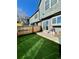 Private backyard with artificial grass, a patio, and a fenced area at 17437 E Rice Cir # B, Aurora, CO 80015