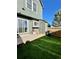 Private backyard with artificial turf, a patio, and a storage shed at 17437 E Rice Cir # B, Aurora, CO 80015