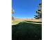 Open backyard with a view of open fields and a large lawn at 17437 E Rice Cir # B, Aurora, CO 80015