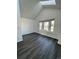 Bright bedroom featuring a skylight, gray flooring, and a window seat at 17437 E Rice Cir # B, Aurora, CO 80015