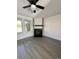 Living room with fireplace and gray vinyl plank flooring at 17437 E Rice Cir # B, Aurora, CO 80015