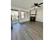 Living room featuring gray flooring, fireplace, and access to the backyard at 17437 E Rice Cir # B, Aurora, CO 80015