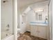 Bathroom featuring a shower and tub, and a sink vanity at 1194 Camp Eden Rd, Golden, CO 80403