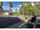 Back deck with chairs overlooking a driveway and trees at 1194 Camp Eden Rd, Golden, CO 80403