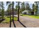 Exterior view featuring a home and a garage with a driveway, showcasing ample parking space at 1194 Camp Eden Rd, Golden, CO 80403