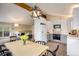 Modern eat-in kitchen with stainless appliances, sleek white cabinets, and backyard views at 1194 Camp Eden Rd, Golden, CO 80403