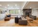 Cozy living room features a stone fireplace, wood floors, and a comfortable seating area at 1194 Camp Eden Rd, Golden, CO 80403