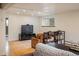 Basement living room featuring a large television and comfortable seating at 1194 Camp Eden Rd, Golden, CO 80403