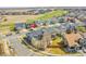 This aerial view shows the beautiful neighborhood, solar panels, and landscaping at 11845 Mobile St, Commerce City, CO 80022