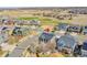 Aerial view of the home featuring solar panels on the roof and surrounding landscape at 11845 Mobile St, Commerce City, CO 80022