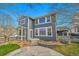 Inviting backyard featuring a concrete patio, landscaped beds, and manicured lawn at 11845 Mobile St, Commerce City, CO 80022