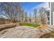 A serene outdoor space with concrete patio, rock garden, lawn, and a classic wooden fence at 11845 Mobile St, Commerce City, CO 80022