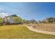 Landscaped community area with benches, sidewalks, green spaces, and attractive homes at 11845 Mobile St, Commerce City, CO 80022