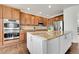 Kitchen featuring granite counters, stainless steel appliances, white cabinets, and hardwood floors at 11845 Mobile St, Commerce City, CO 80022