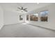 Large main bedroom with lots of windows and natural light, plush carpet and ceiling fan at 11845 Mobile St, Commerce City, CO 80022