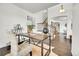 Cozy office shows hardwood floors, neutral walls, a desk, and access to the entryway at 11845 Mobile St, Commerce City, CO 80022