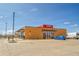 Front view of Santiagos restaurant with parking and clear blue sky at 11845 Mobile St, Commerce City, CO 80022