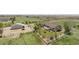 Aerial view of the home, barn, fields and surrounding neighborhood at 32501 E 137Th Way, Brighton, CO 80603