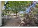 Scenic backyard with a stone patio, mature trees, and cozy seating arrangements at 32501 E 137Th Way, Brighton, CO 80603