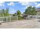 Outdoor deck offers a view of a lush backyard with trees and a well-maintained lawn at 32501 E 137Th Way, Brighton, CO 80603