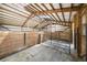 Interior stall with concrete floor, wood paneling and steel gate at 32501 E 137Th Way, Brighton, CO 80603