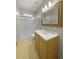 Bathroom featuring a walk-in shower, neutral-colored walls, and a single sink vanity with ample storage at 32501 E 137Th Way, Brighton, CO 80603
