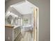 Bathroom with double sinks, a soaking tub, and modern finishes at 32501 E 137Th Way, Brighton, CO 80603