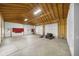 Large, unfinished garage with two doors, suitable for vehicles and equipment storage at 32501 E 137Th Way, Brighton, CO 80603