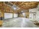 Spacious garage with two large doors, providing ample room for vehicles and storage at 32501 E 137Th Way, Brighton, CO 80603