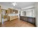 Kitchen features a wet bar, dark cabinetry, stainless steel appliances, hardwood floors, and recessed lighting at 32501 E 137Th Way, Brighton, CO 80603