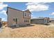 Exterior shot of the home and backyard with patio at 9264 Biscay St, Commerce City, CO 80022