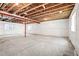 Unfinished basement featuring concrete floor and exposed ceiling at 9264 Biscay St, Commerce City, CO 80022