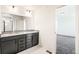 Modern bathroom features double vanity with granite countertop and a separate room at 9264 Biscay St, Commerce City, CO 80022