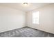 Bedroom offers neutral walls, gray carpet, and natural light at 9264 Biscay St, Commerce City, CO 80022