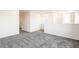 Open bonus room offers plush gray carpeting and abundant natural light at 9264 Biscay St, Commerce City, CO 80022