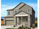 Charming two-story home featuring a covered front porch, neutral siding, stone accents, and attached two-car garage at 9264 Biscay St, Commerce City, CO 80022