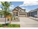 Charming two-story home featuring neutral paint, stone accents and a two-car garage at 9264 Biscay St, Commerce City, CO 80022